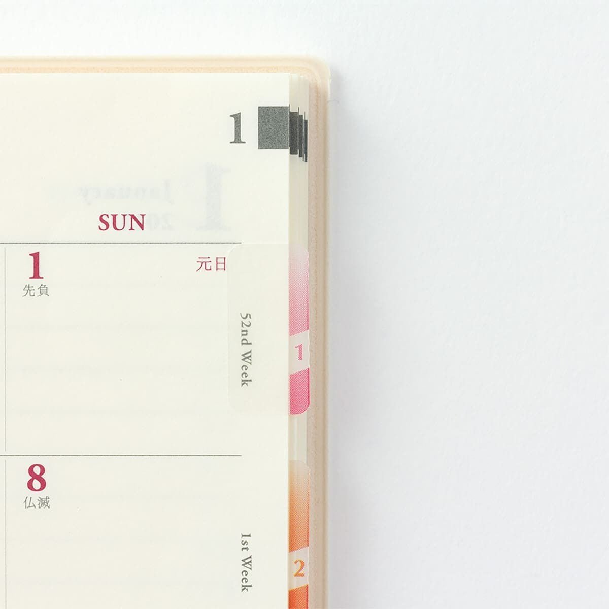 En uppslagen kalender med indexflikar insatta. Indexflikarna har nummer ett och två på. - Tidformera