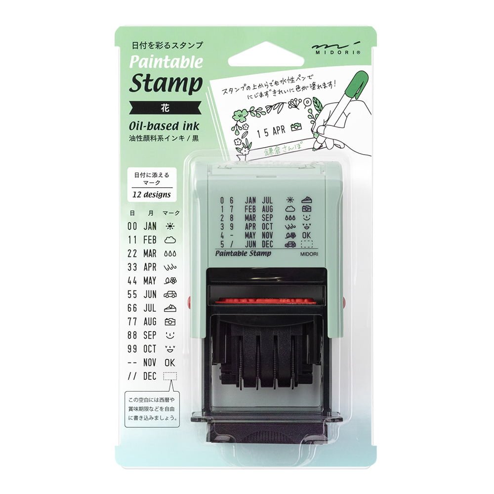 Stämpel Paintable Rotating Date Stor - Date Flowers från Midori. Förpackning med stämpel där du kan rulla fram det datum som passar. Blomsterram runt datumet,- Tidformera