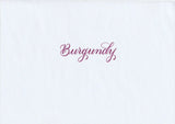Handskriven text med ordet "Burgundy" i rödlila färg, skriven med Pentel Brush Sign Pen i färgen Burgundy.