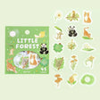 Förpackning med klistermärken. Stickers ligger utspridd. Koala, katt, panda, hund, fågel och växter. Flake stickers Little Forest - Green från BGM - Tidformera