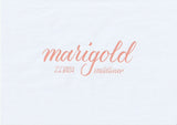 Handskriven text med orden "marigold" och "ZEBRA mildliner" i orange färg, skriven med Zebra Mildliner Brush Pen i färgen Marigold.