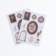 Två ark med kliskermärken. Tavlor i vintagestil, guldsax och ljusstake. Sticker Set - Frame Wall - 2 ark -från Archer & Olive - Tidformera