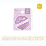 Förpackning och en utrullad dekorationstejp. Guldmönster mot vit bakgrund. Washi Tape Gold Basic Mystery pattern - 5 mm från BGM - Tidformera